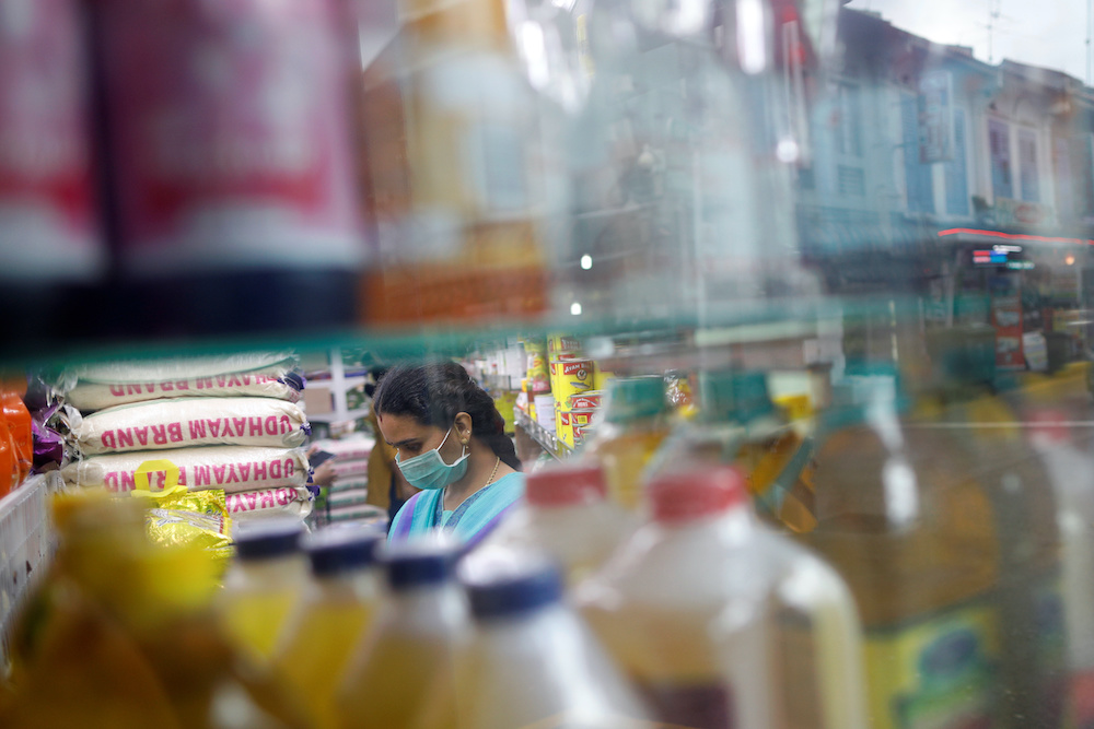 A woman wears a face mask at a shop in Little India district, as the spread of coronavirus disease (Covid-19) continues, in Singapore, April 2, 2020.u00e2u20acu201d Reuters pic