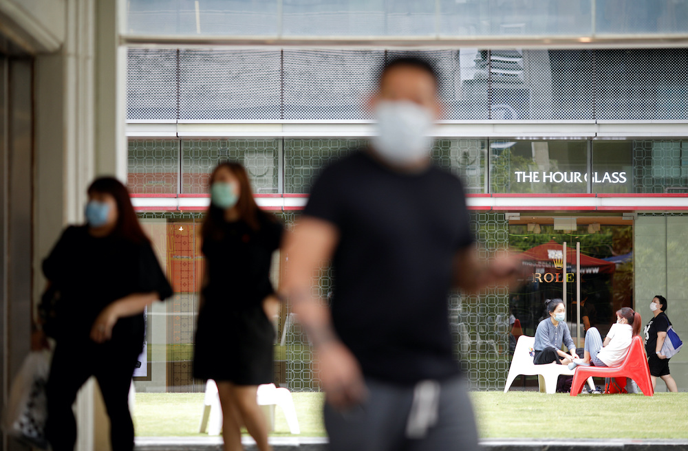 People wear face masks during the outbreak of coronavirus disease (Covid-19) in Singapore, April 3, 2020. u00e2u20acu201d Reuters picnn