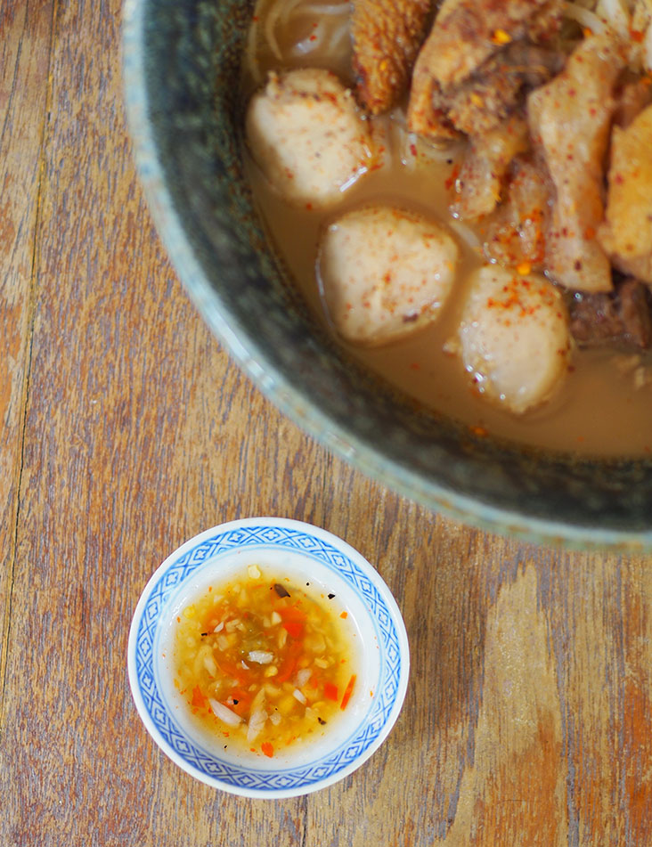 The vinegar-based dip with char roasted garlic and chillies gives your noodles an appetising taste