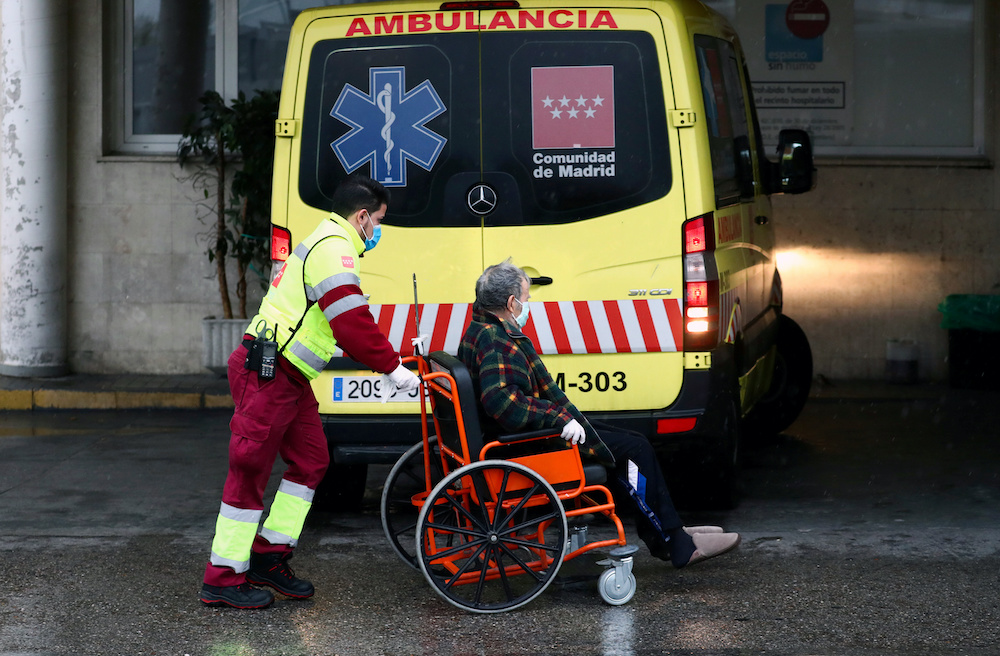 An ambulance worker arrives with a patient at the 12 de Octubre Hospital, amid the coronavirus disease (Covid-19) outbreak, in Madrid, Spain March 31, 2020. — Reuters pic