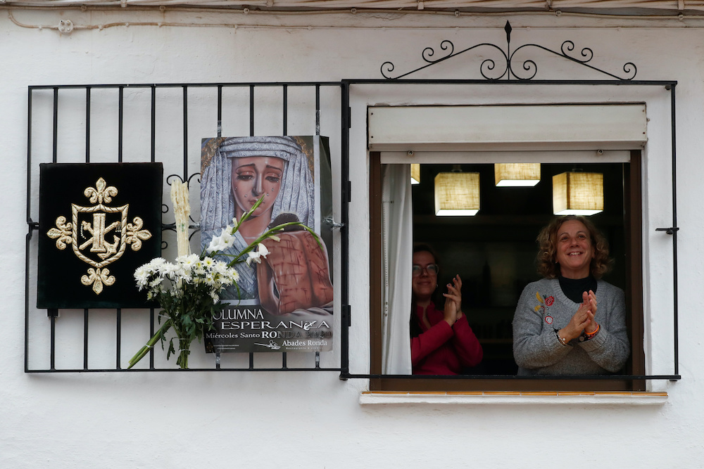 People applaud in support of healthcare workers as they celebrate the Holy Week amid the coronavirus disease (Covid-19) outbreak, in Ronda, southern Spain, April 8, 2020. u00e2u20acu201d Reuters pic