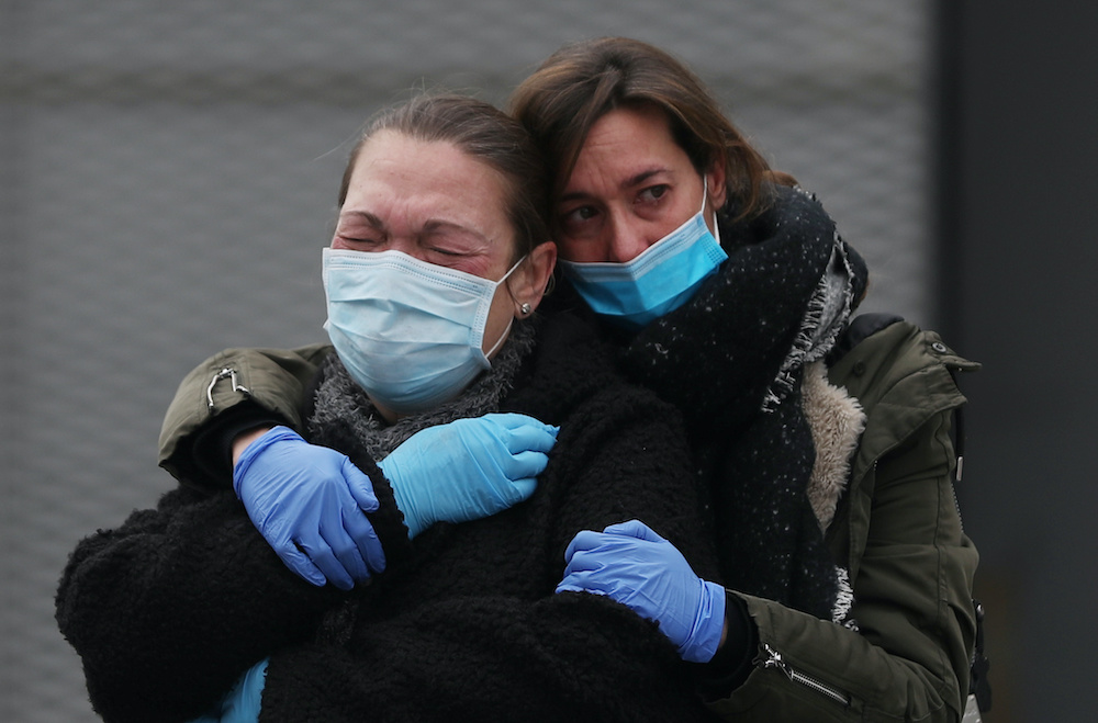 Relatives of hospital worker Marisol Sacristan react before a minutes silence is held in her memory outside Segoviau00e2u20acu2122s General Hospital after she died of Covid-19, amid the coronavirus disease outbreak in Segovia, Spain, April 23, 2020. u00e2u20acu2022 Reuters pic