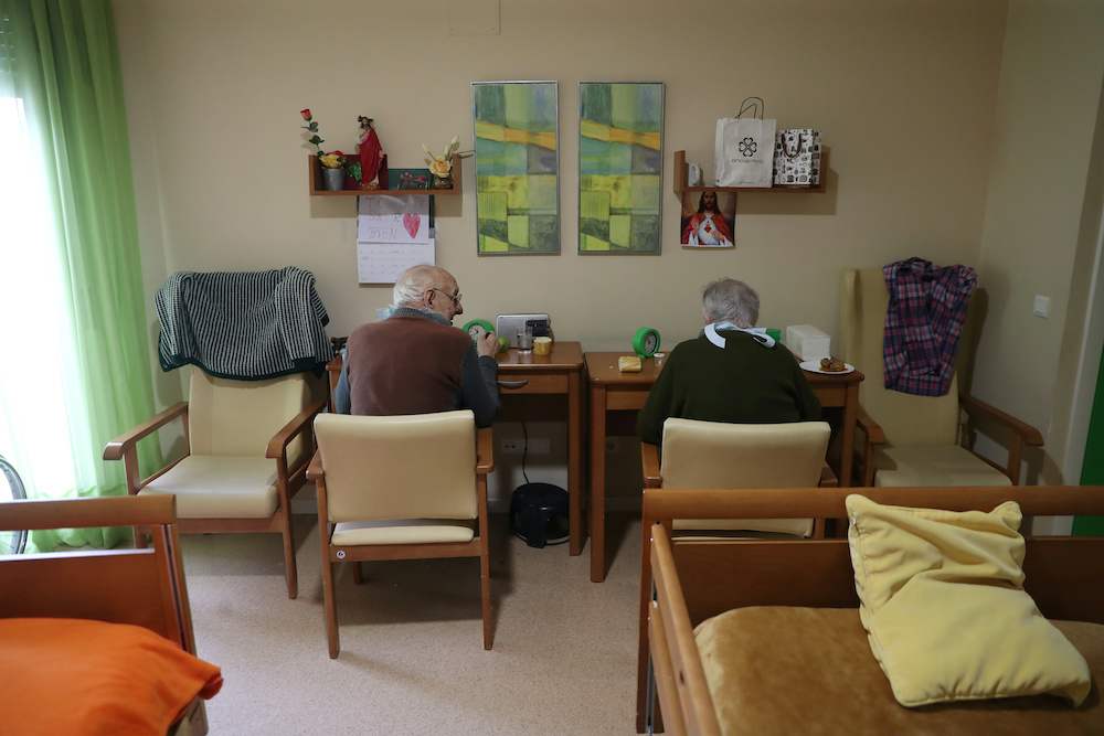 Jesus Escribano and his wife Irene Gonzalez have lunch together in their room since the dining room was closed to ensure the residents safety during lockdown amid the coronavirus disease outbreak at Oteruelo nursing home in Valverde del Majano, Spain, Apr