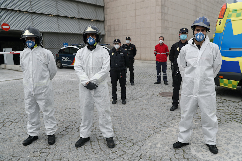 Firefighters and Police during a minutes silence outside Segovia’s General Hospital to remember hospital worker Marisol Sacristan, who died of Covid19, amid the coronavirus disease outbreak in Segovia, Spain, April 23, 2020. ― Reuters pic