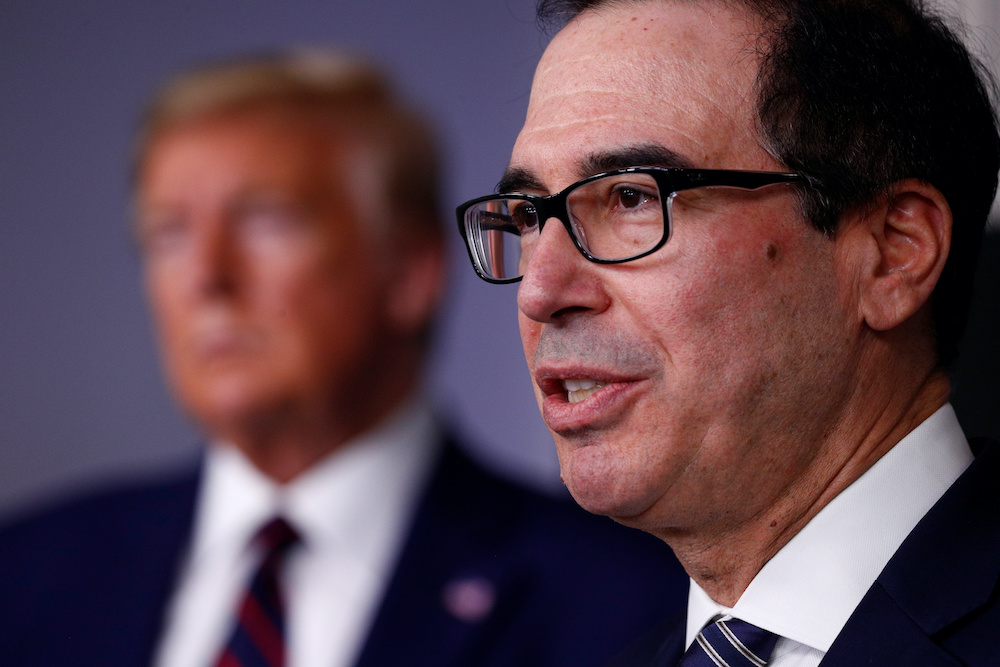 Treasury Secretary Steven Mnuchin addresses the daily coronavirus response briefing as US President Donald Trump listens at the White House in Washington, US, April 2, 2020. u00e2u20acu201d Reutersnnn