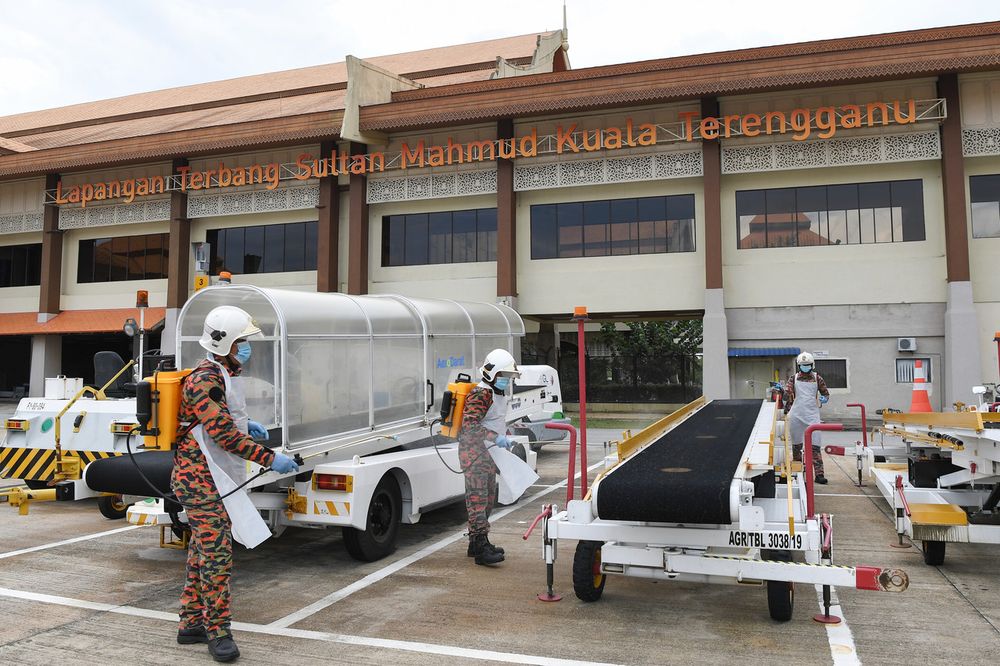 Members of the Fire and Rescue Department (JBPM) from the Kuala Nerus Fire and Rescue Station carrying out Covid-19 decontamination at Sultan Mahmud Airport, Kuala Terengganu, April 15, 2020. u00e2u20acu201d Bernama pic
