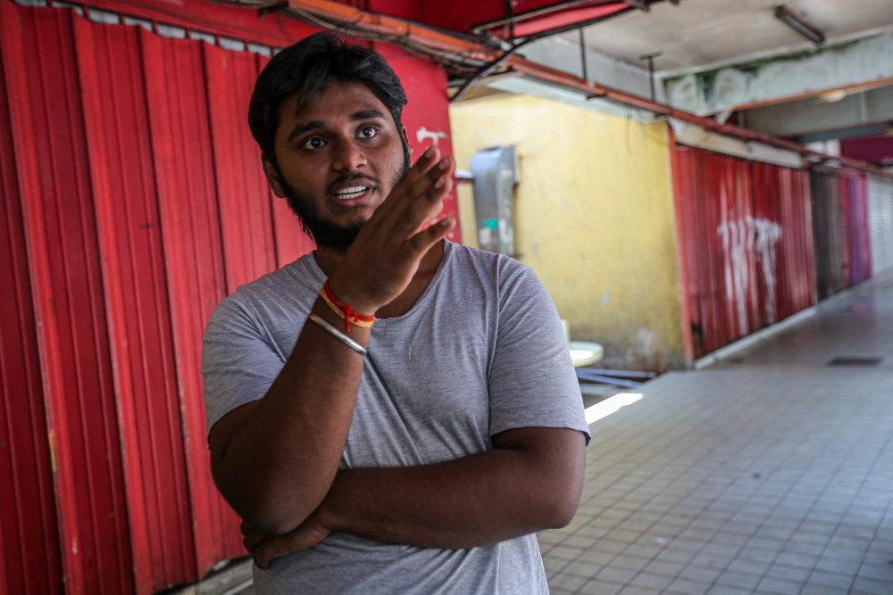 Electrician Sanjay Raj speaks to Malay Mail at the Taman Wilayah low-cost flats in Kuala Lumpur April 21, 2020. — Picture by Hari Anggara