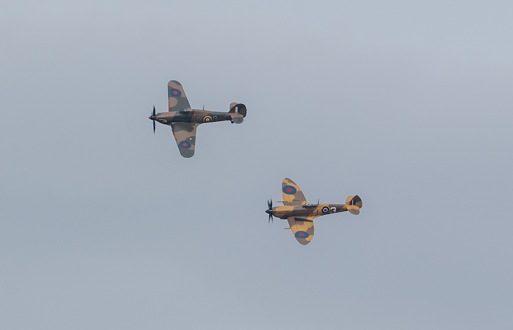 A Battle of Britain Memorial Flight flypast of a Spitfire and a Hurricane passes over the home of Second World War veteran Captain Tom Moore as he celebrates his 100th birthday. – Reuters pic