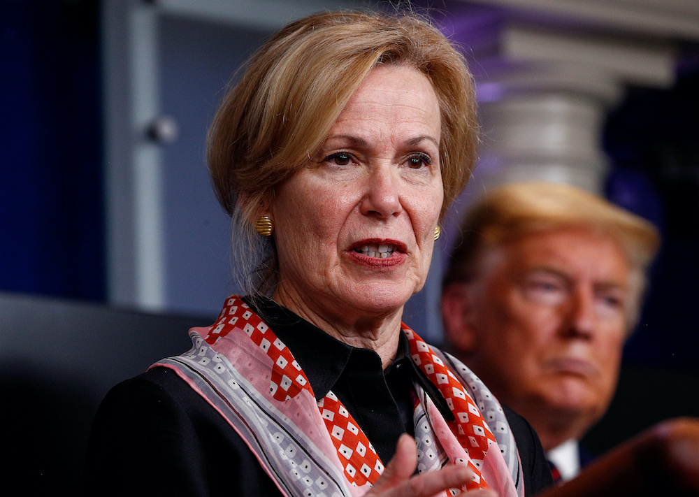 US President Donald Trump takes questions from members of the news media beside Ambassador Debbie Birx, the White House coronavirus response coordinator, during a daily briefing on coronavirus disease (Covid-19) response at the White House in Washington, 