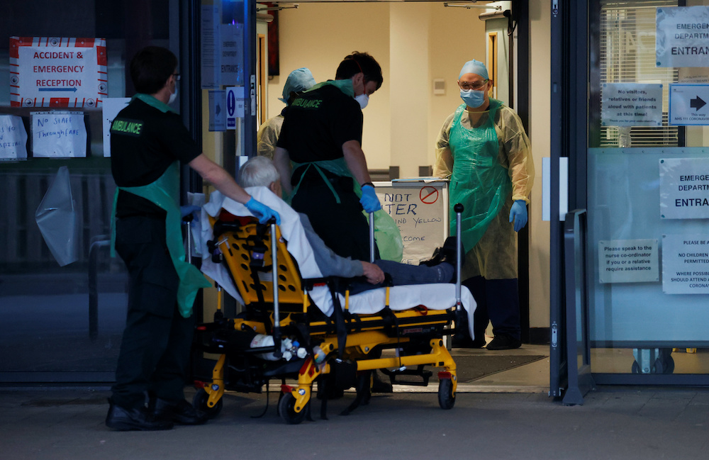 A man is admitted to the hospital on a stretcher at the Aintree University Hospital during the Clap for our Carers campaign in support of the NHS as the spread of the coronavirus disease continues, Liverpool, Britain, April 16, 2020. u00e2u20acu201d Reuters pic