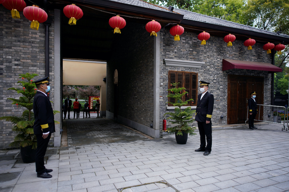 Security guards wearing masks stand guard at an entrance in the Tanhualin neighborhood after the lockdown was lifted in Wuhan, capital of Hubei province and Chinau00e2u20acu2122s epicentre of the novel coronavirus disease outbreak, April 10, 2020. u00e2u20acu201d  Reuters picn n