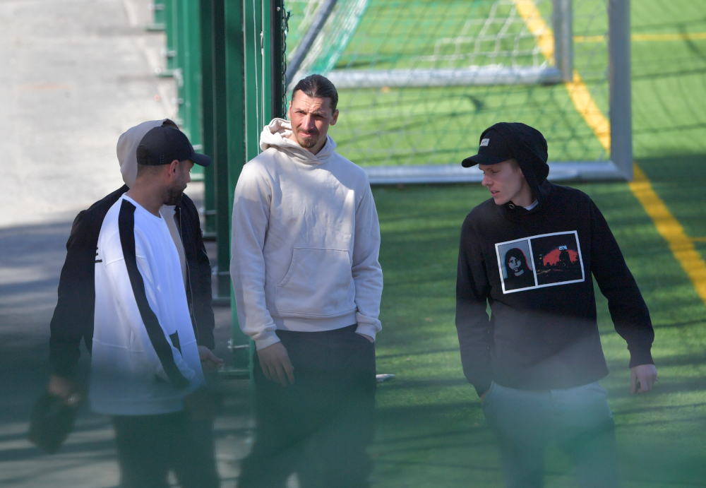 AC Milanu00e2u20acu2122s Swedish forward Zlatan Ibrahimovic (centre) talks with fans as he leaves the Arsta IP training ground in Stockholm April 9, 2020 after participating in a training session of the Swedish footboll league club Hammarbyu00e2u20acu2122s. u00e2u20acu201d AFP pic