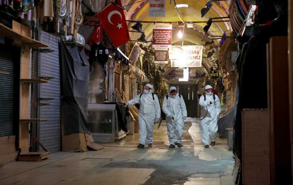Workers in protective suits spray disinfectant at Grand Bazaar, known as the Covered Bazaar, to prevent the spread of coronavirus disease in Istanbul March 25, 2020. u00e2u20acu2022 Reuters pic