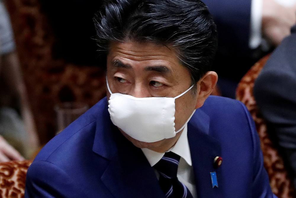 Japan's Prime Minister Shinzo Abe wears a protective face mask at an upper house parliamentary session  in Tokyo April 1, 2020. u00e2u20acu201d Reuters pic