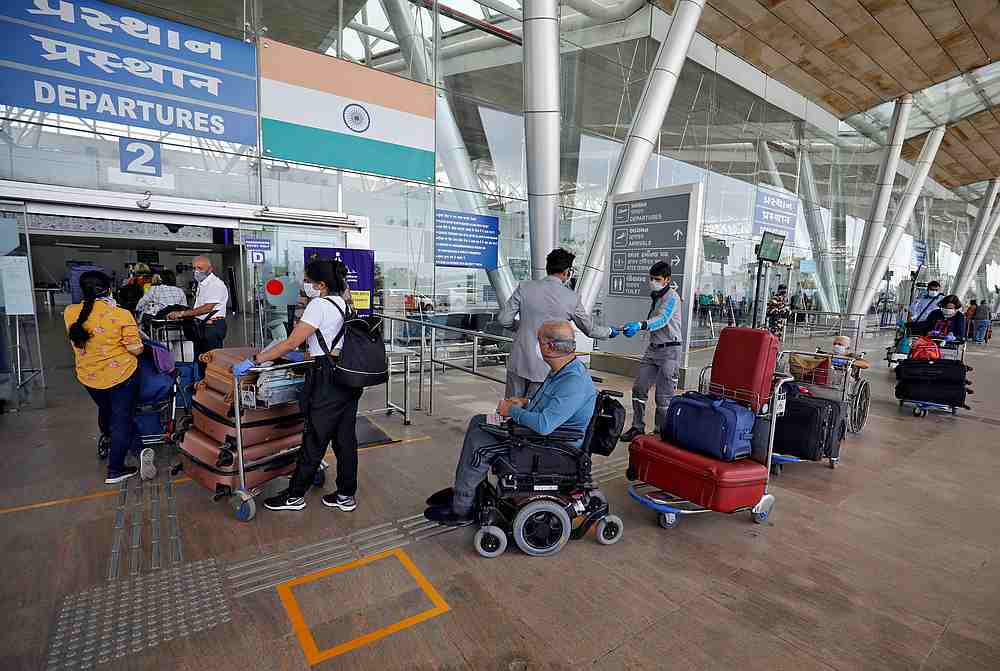 Stranded British citizens enter the airport to board a special British Airways aircraft at the Sardar Vallabhbhai Patel International (SVPI) airport in Ahmedabad, India April 13, 2020. u00e2u20acu201d Reuters pic
