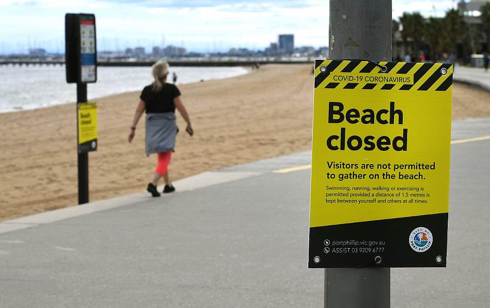 People exercise on the St Kilda Promenade in Melbourne on April 10, 2020 as authorities plead with Australians to stay at home over the Easter break. u00e2u20acu201d AFP pic