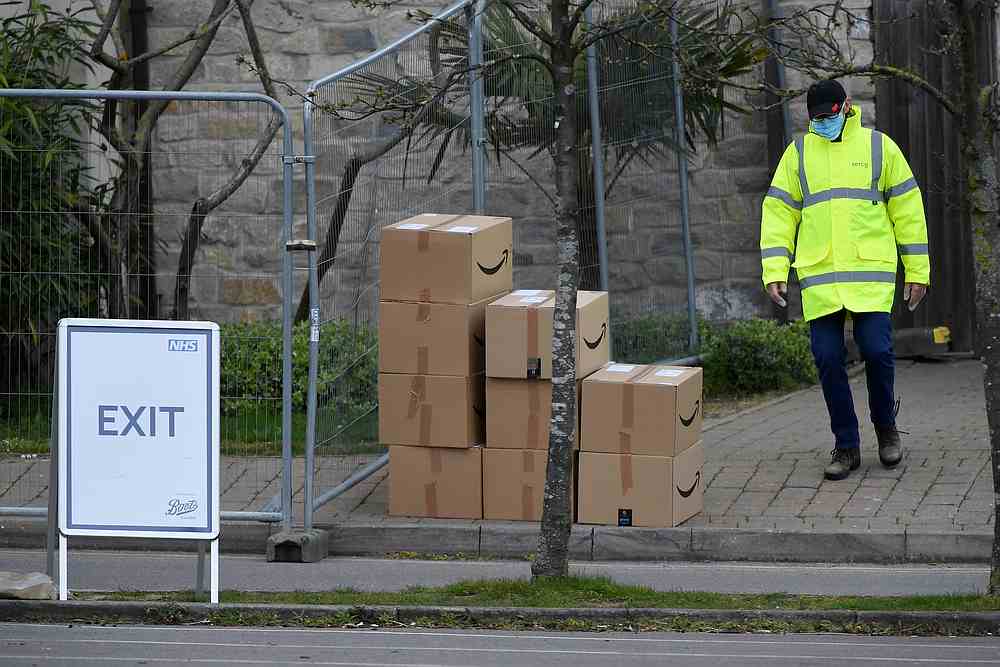 Boxes with a Amazon logo are seen arriving at a coronavirus test centre in the car park of Chessington World of Adventures, Chessington, Britain April 2, 2020. u00e2u20acu201d Reuters pic