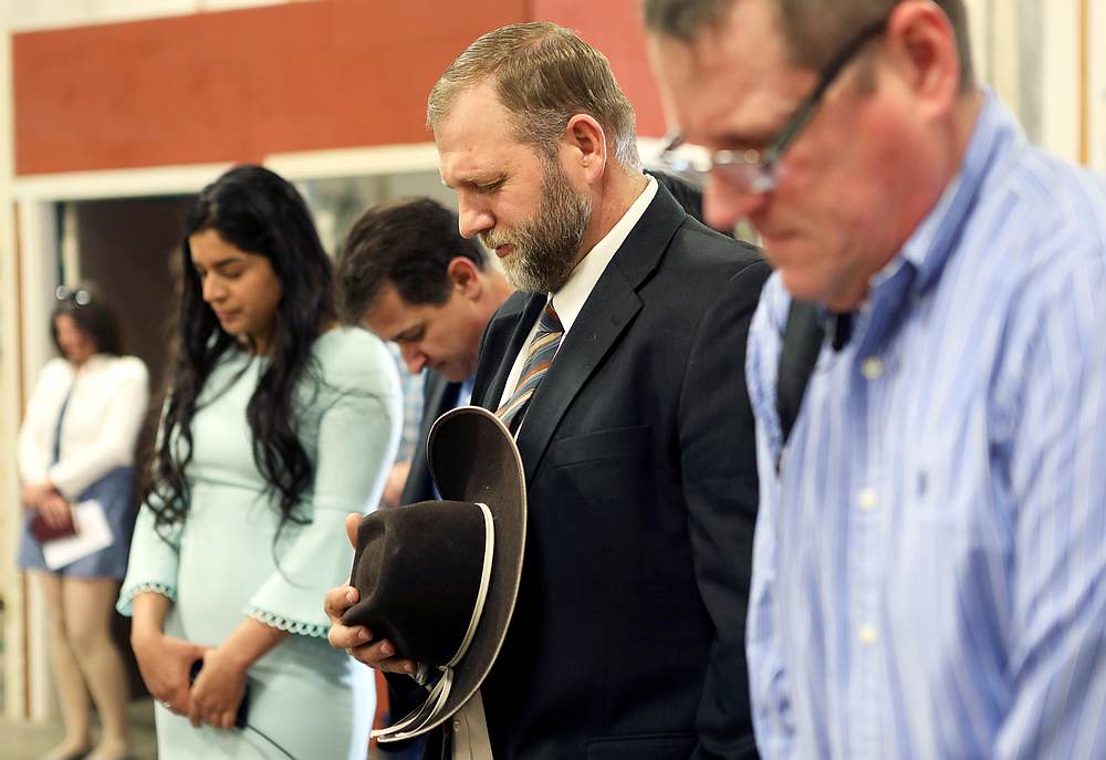 Libertarian activist Ammon Bundy prays during an Easter Sunday church service he organised despite concerns over the Covid-19 outbreak in Emmett, Idaho April 12, 2020. u00e2u20acu201d Reuters pic