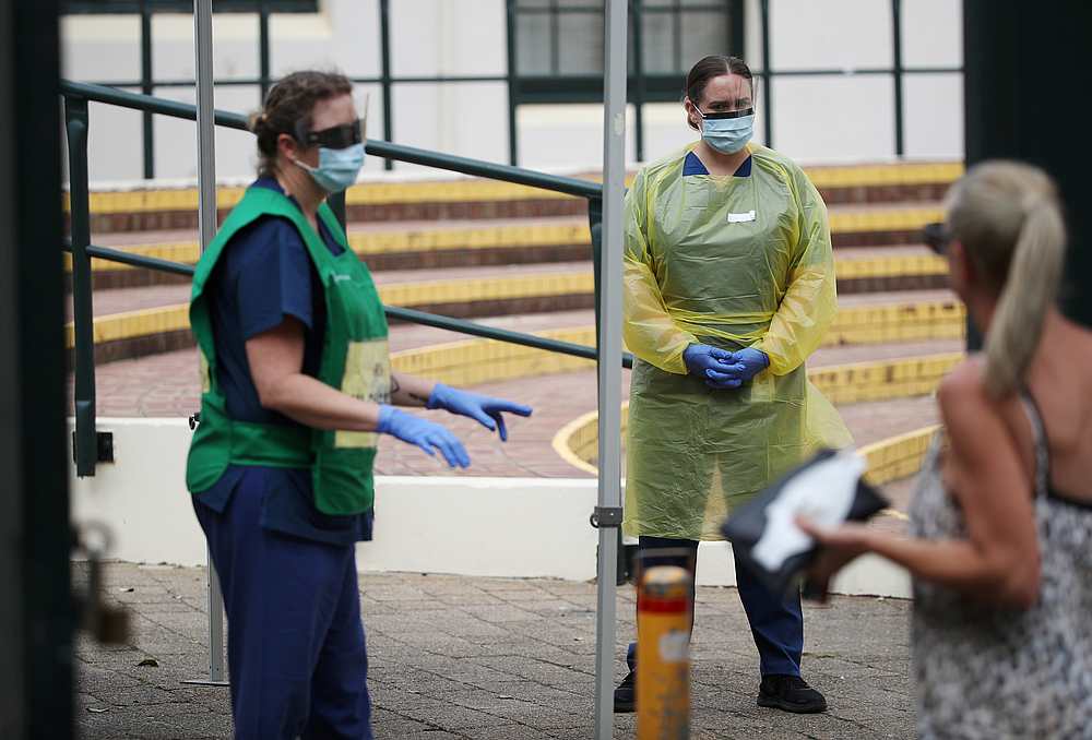 Healthcare professionals direct a woman at a pop-up clinic testing for Covid-19 at Bondi Beach, after several outbreaks were recorded in the area, in Sydney, Australia April 1, 2020. u00e2u20acu201d Reuters pic