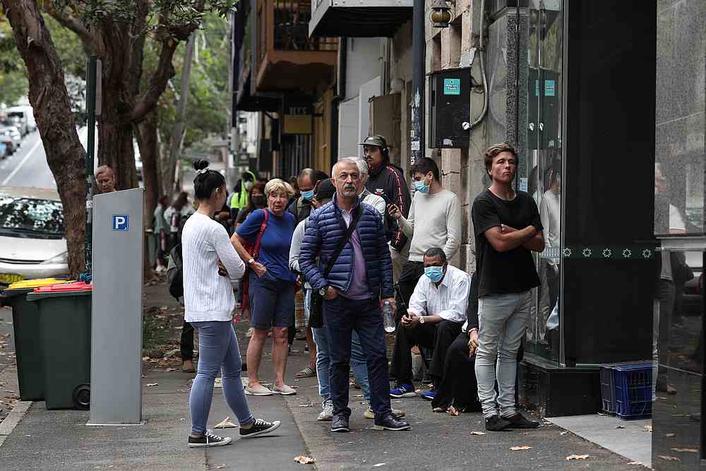 People stand in a queue outside a Centrelink office in Sydney, Australia March 26, 2020. u00e2u20acu201d Reuters pic