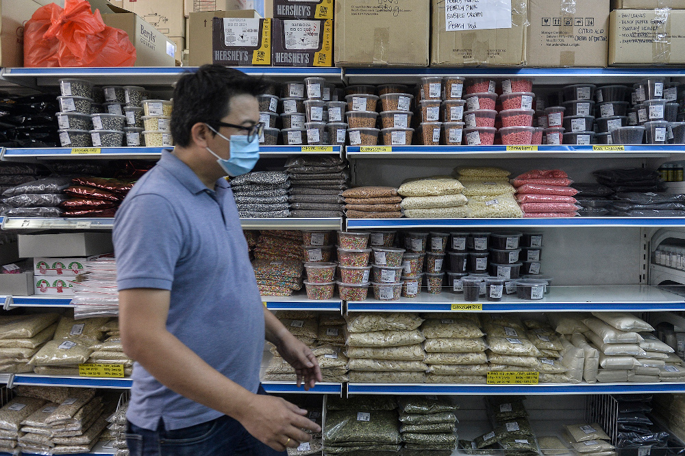 A customer shops for baking supplies at a bakery supply shop during movement control order (MCO) in Shah Alam April 22, 2020. u00e2u20acu201d Picture by Miera Zulyanann