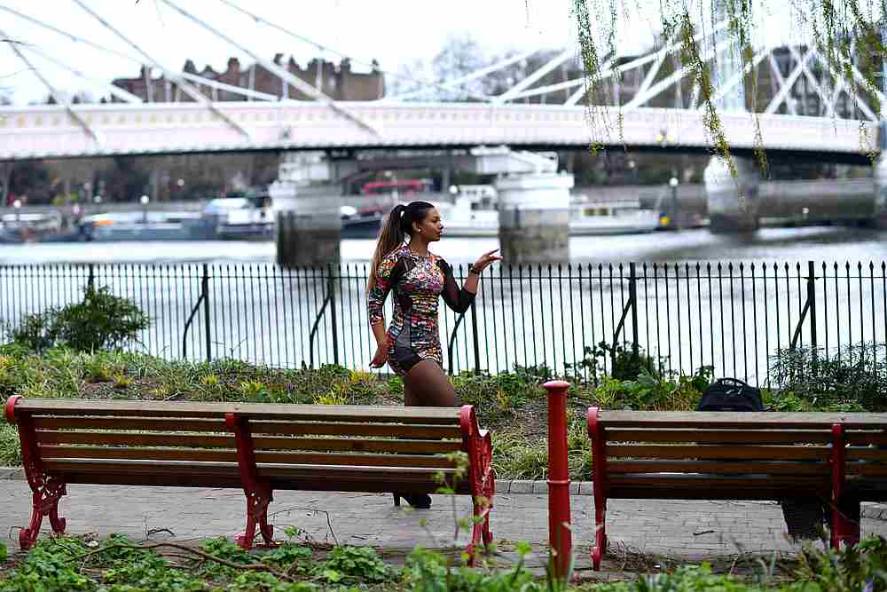 Lorna Bee dances beside Albert Bridge as she enjoys her daily exercise in Battersea Park in London, as the spread of Covid-19 continues in Britain April 1, 2020. u00e2u20acu201d Reuters pic