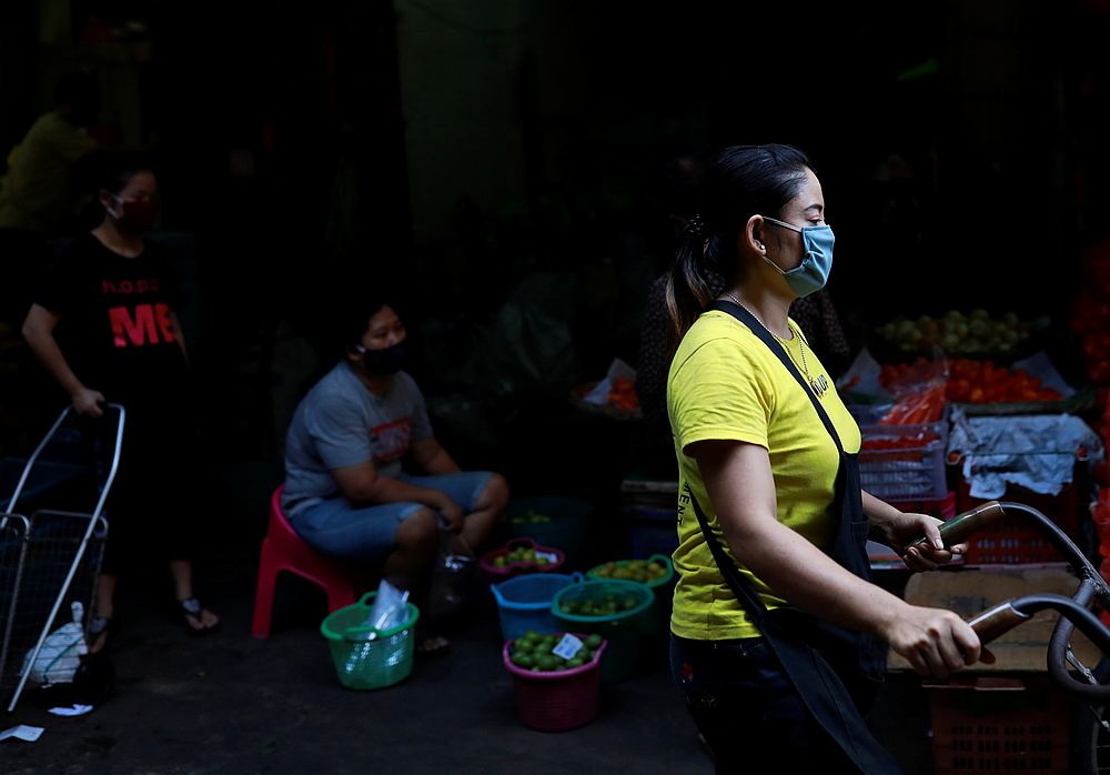 Women wear protective face masks as they work in a market during the Covid-19 outbreak in Bangkok, Thailand April 6, 2020. u00e2u20acu201d Reuters pic