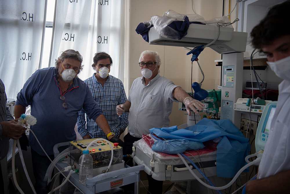 Dr Roberto Canessa, one of the 16 survivors of an air plane crash in the Chilean Andes in 1972, speaks with a group of robotics engineers and doctors. u00e2u20acu201d AFP pic