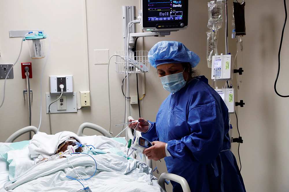 A doctor runs tests on a patient being monitored for Covid-19 in the emergency room at Roseland Community Hospital on the South Side of Chicago, Illinois April 22, 2020. u00e2u20acu201d Reuters pic