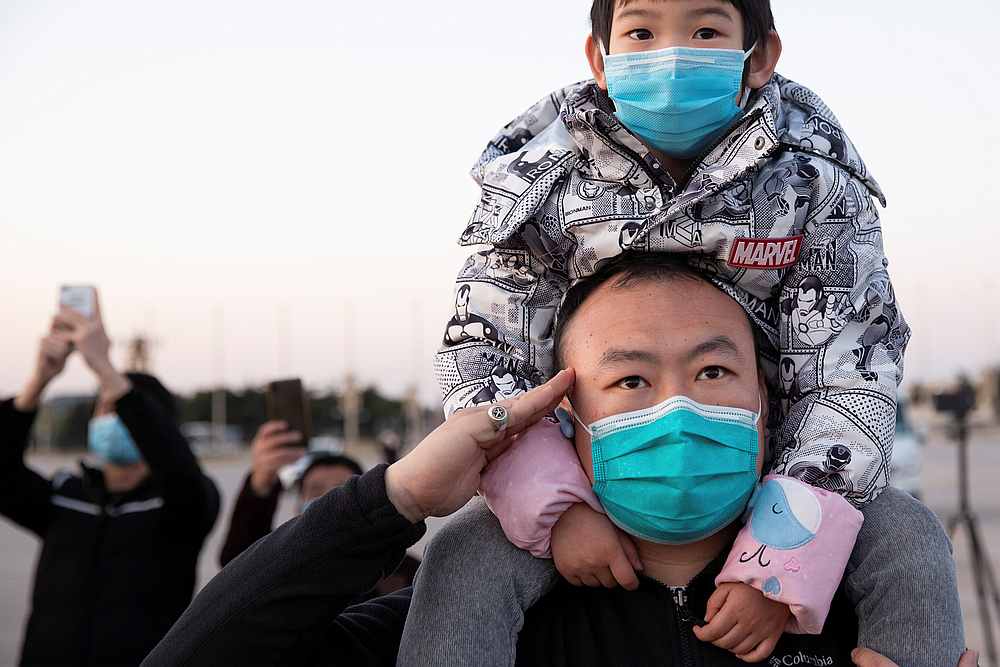 A man wearing a face mask salutes during a ceremony at Tiananmen Square in Beijing in national mourning for those who died of Covid-19, April 4, 2020. u00e2u20acu201d China Daily pic via Reuters