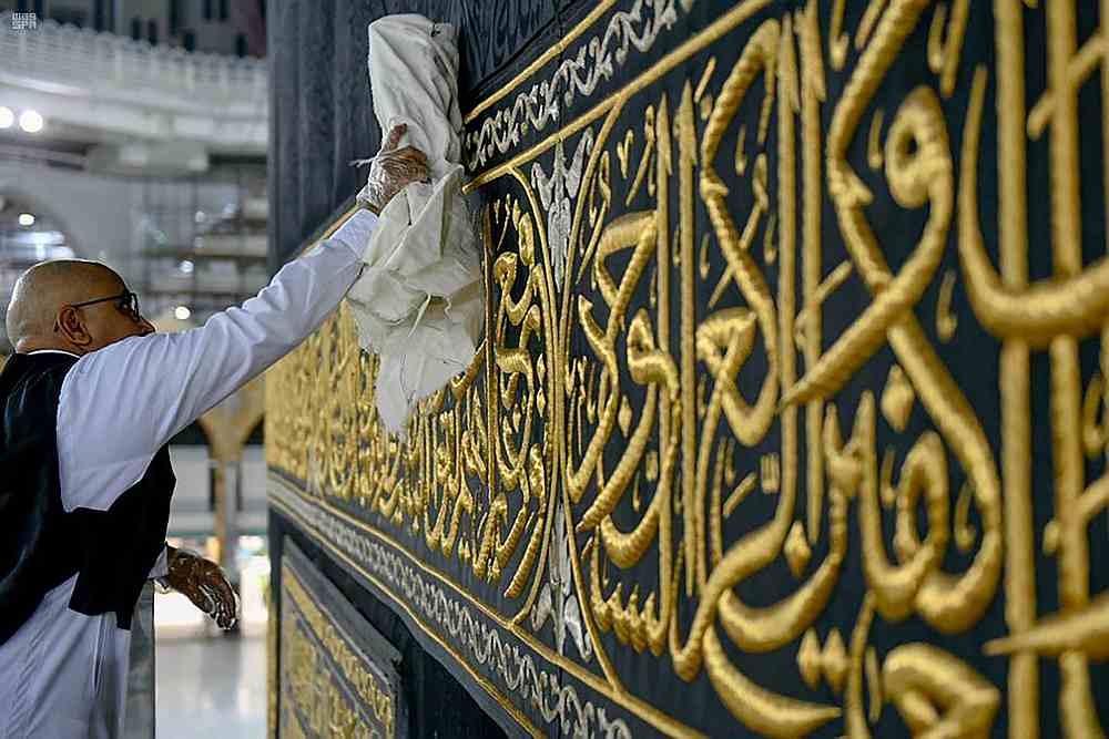 A worker cleans and sterilises the Kaaba, following the outbreak Covid-19, ahead of the holy fasting month of Ramadan, in the Grand mosque of Mecca, Saudi Arabia April 21, 2020. u00e2u20acu201d Saudi Press Agency handout via Reuters