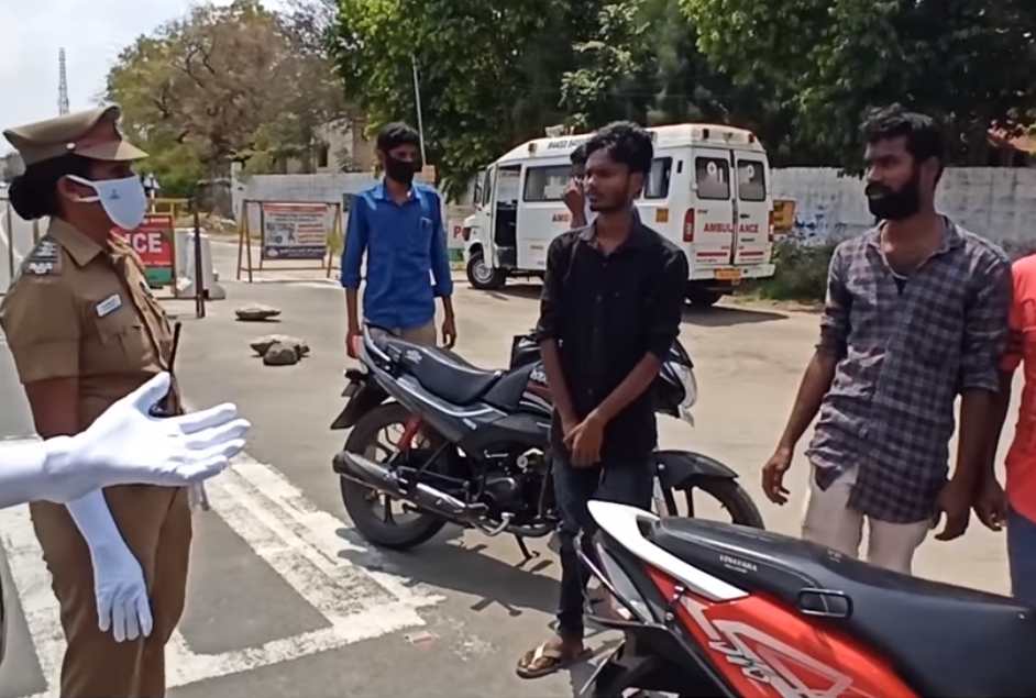 The three men were stopped for riding on a single motorbike together without wearing face masks. — Screengrab via Facebook/Tamil Nadu Police