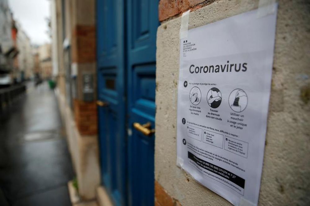 A placard with information about the coronavirus (Covid-19) is displayed in front of a school in Paris, France, March 10, 2020. u00e2u20acu201d Reuters pic
