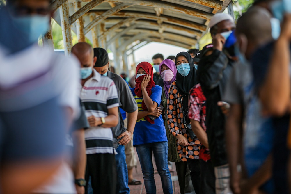People are seen queuing up to take the Covid-19 test at Kg Baru in Kuala Lumpur April 11, 2020. u00e2u20acu2022 Picture by Hari Anggara