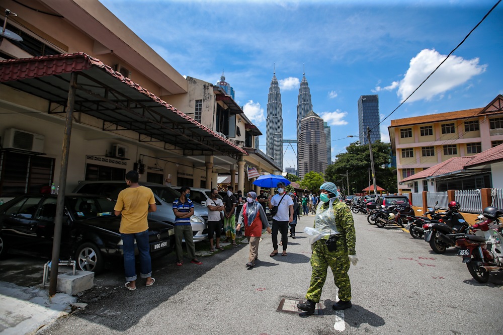 People are seen queuing up to take the Covid-19 test at Kg Baru in Kuala Lumpur April 11, 2020. u00e2u20acu2022 Picture by Hari Anggara