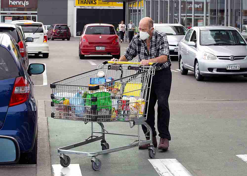 Brian Green, 76, wears a mask as he wheels his supermarket shopping cart to his car outside Pak'nSave supermarket amid the spread of Covid-19 in Christchurch, New Zealand, March 23, 2020. u00e2u20acu201d Reuters pic