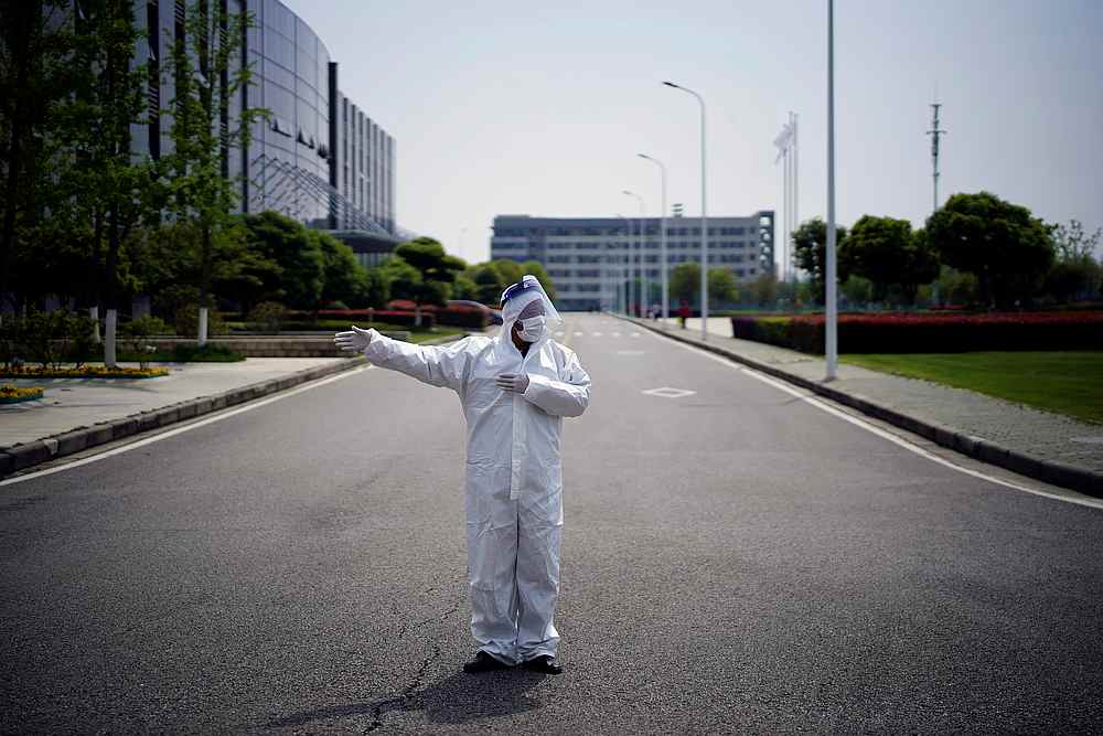 nA worker in a protective suit is seen at a Dongfeng Honda factory after lockdown measures in Wuhan were further eased April 8, 2020. u00e2u20acu201d Reuters pic