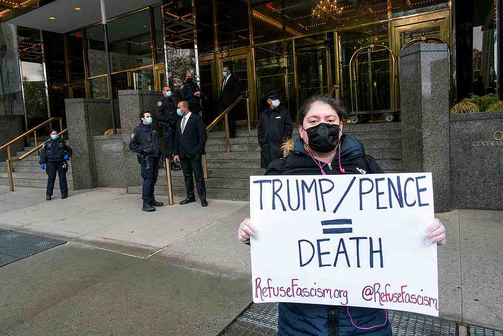 A demonstrator holds a sign during a protest against US President Donald Trump and his policies outside Trump International Hotel in New York April 18, 2020. u00e2u20acu201d Reuters pic