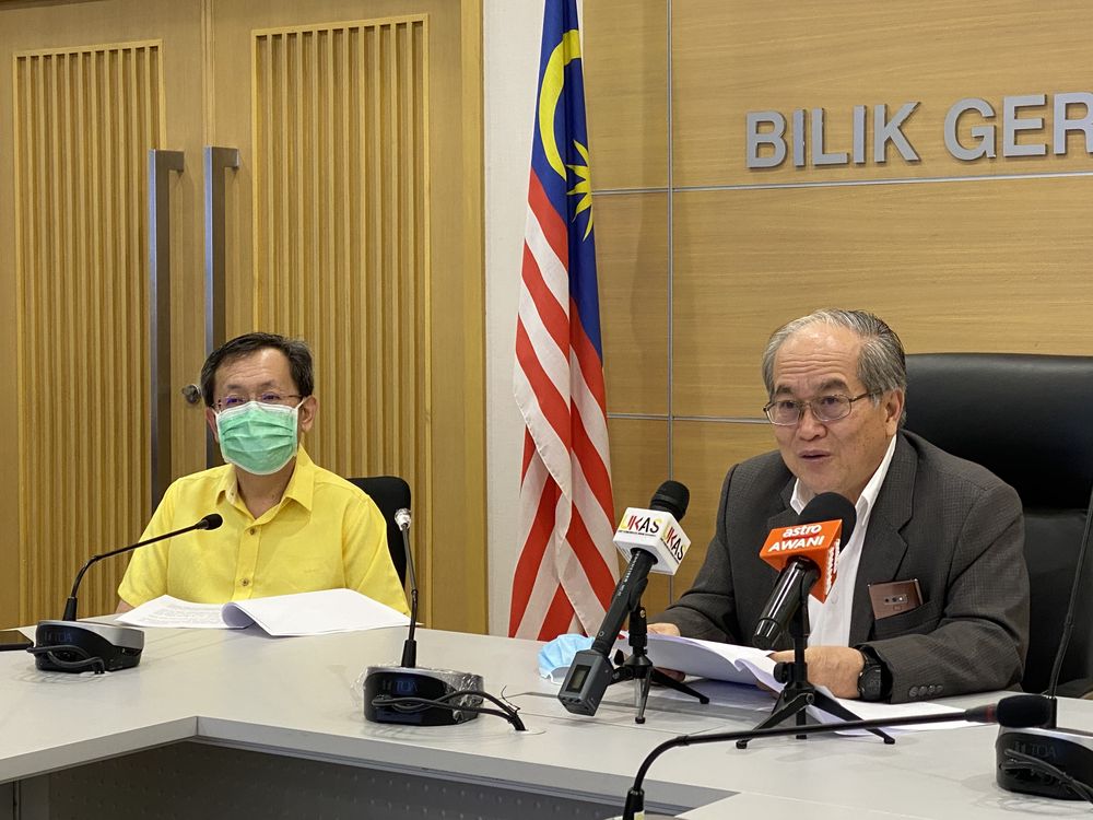 SDMC chairman Datuk Amar Douglas Uggah (right) speaking to reporters on the coronavirus infection updates in Sarawak, April 15, 2020. u00e2u20acu201d Picture courtesy of Sarawak Public Communications Unit (Ukas)