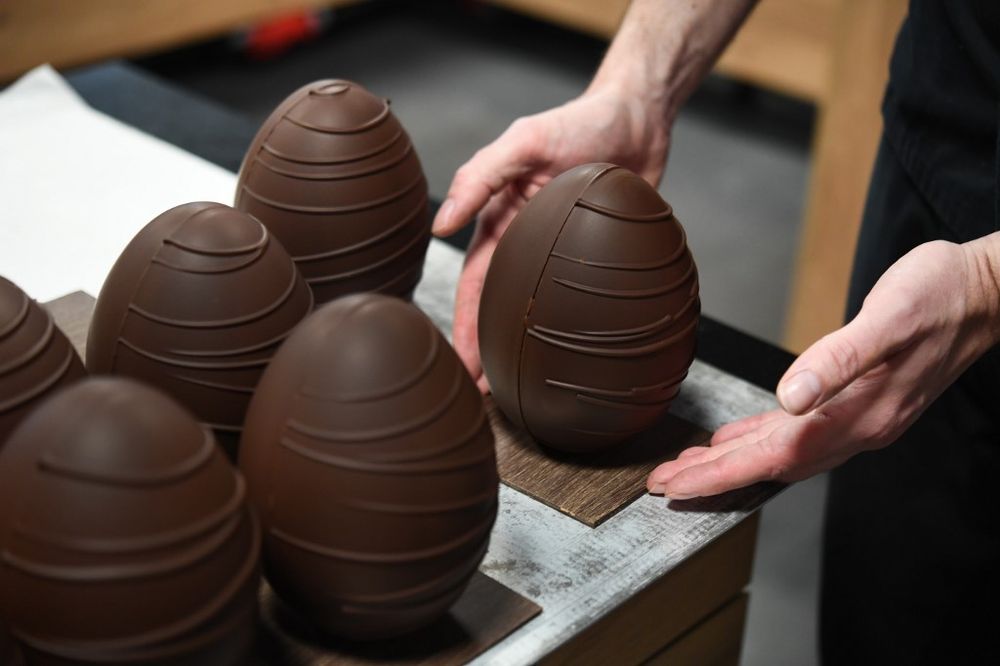 French chocolate maker Jeremy Thierry, adjusts a display chocolate Easter eggs in the workshop u00e2u20acu02dcAtelier Nu00c2u00b0 5u00e2u20acu2122 in La Foret-Fouesnant, France April 7, 2020, ahead of the Christian Festival of Easter. u00e2u20acu201d AFP pic