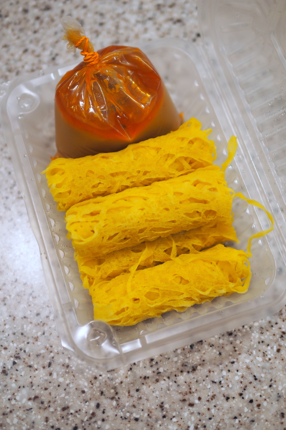 ‘Roti jala’ with curry is prepared by QylaeitLcious which used to be at Bazaar Kampung Melayu Subang. — Picture by Lee Khang Yi
