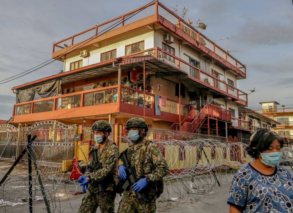 Armed Forces personnel patrol the vicinity of Selayang Baru during the enhanced movement control order April 26, 2020. u00e2u20acu2022 Picture by Firdaus Latif