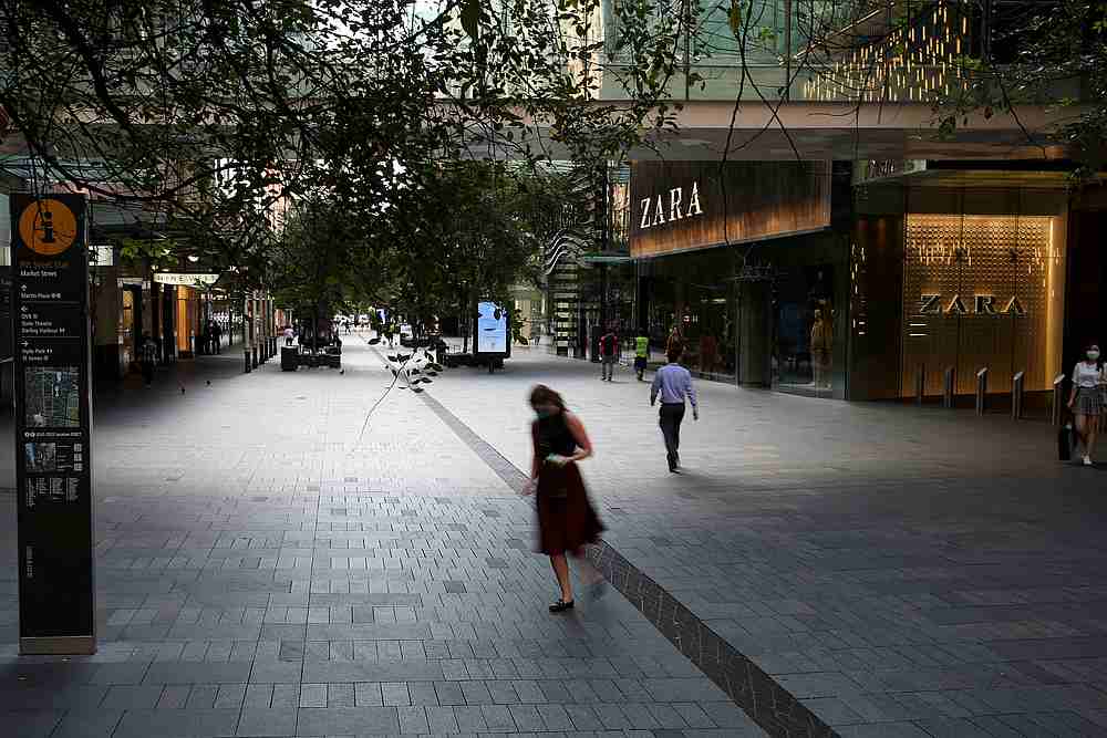People walk by an almost empty commercial area during a workday following the implementation of stricter social-distancing and self-isolation rules in Sydney, Australia March 31, 2020. u00e2u20acu201d Reuters pic