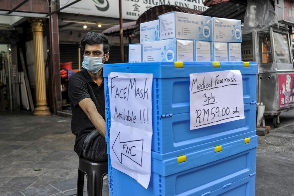 A vendor sells face masks in Kuala Lumpur April 14, 2020. u00e2u20acu201d Picture by Shafwan Zaidon