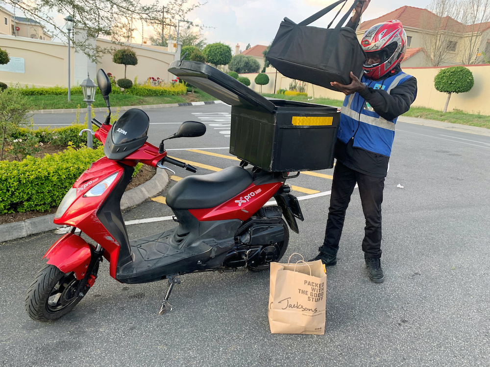 A Mr D Food delivery worker delivers grocery items from a local food market to a customer, during a nationwide lockdown aimed at limiting the spread of the coronavirus disease, in Midrand, South Africa April 26,2020. u00e2u20acu201dReuters picnn