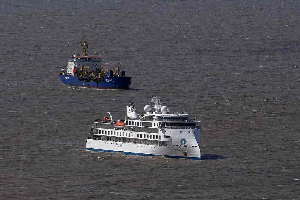 Aerial view of Australian cruise ship Greg Mortimer (bottom) off the port of Montevideo, Uruguay April 7, 2020. u00e2u20acu201d AFP pic