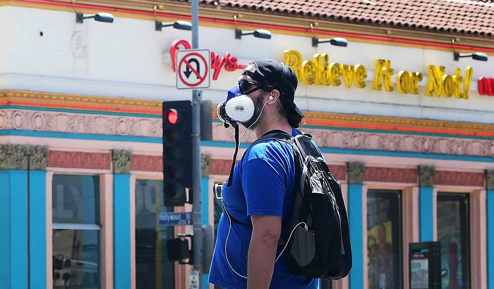 A pedestrian in a facemask walks in Hollywood, California April 23, 2020. u00e2u20acu201d AFP pic