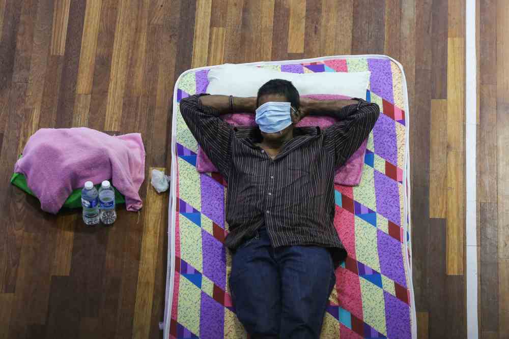 A man catches a wink at the temporary shelter in Kuala Lumpur April 1, 2020. ― Picture by Yusof Mat Isa