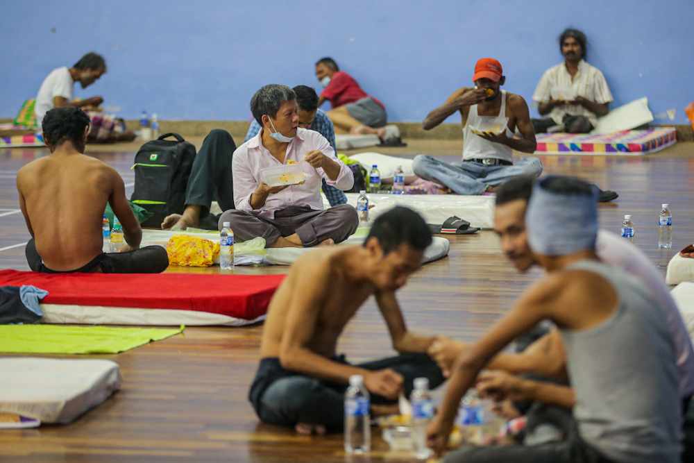 A few men are seen having a meal together at the ‘Pusat Komuniti Sentul Perdana’ in Kuala Lumpur April 2, 2020. ― Picture by Hari Anggara