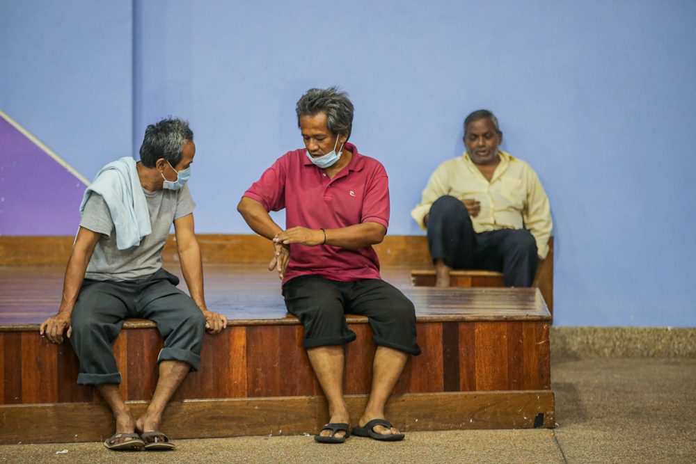 A few men are seen lounging around at the ‘Pusat Komuniti Sentul Perdana’ in Kuala Lumpur April 2, 2020. ― Picture by Hari Anggara